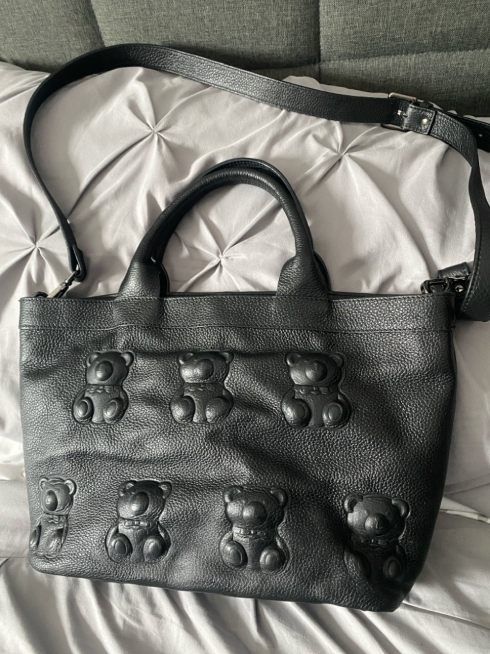 Black Leather Tote with Embossed Teddy Motif, bottom has water damage.